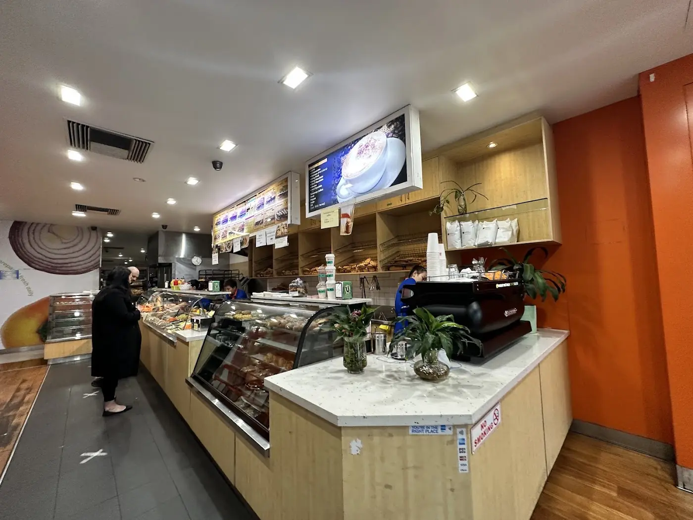 Inside N.Tran Bakery with its orange walls and long counter